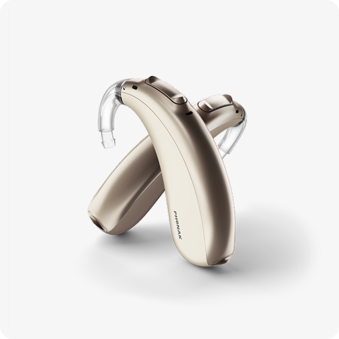 A pair of hearing aids on a white background, recommended by an audiologist for improved hearing.