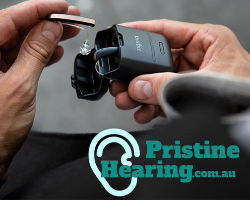 A person holding ear buds, promoting pristine hearing.